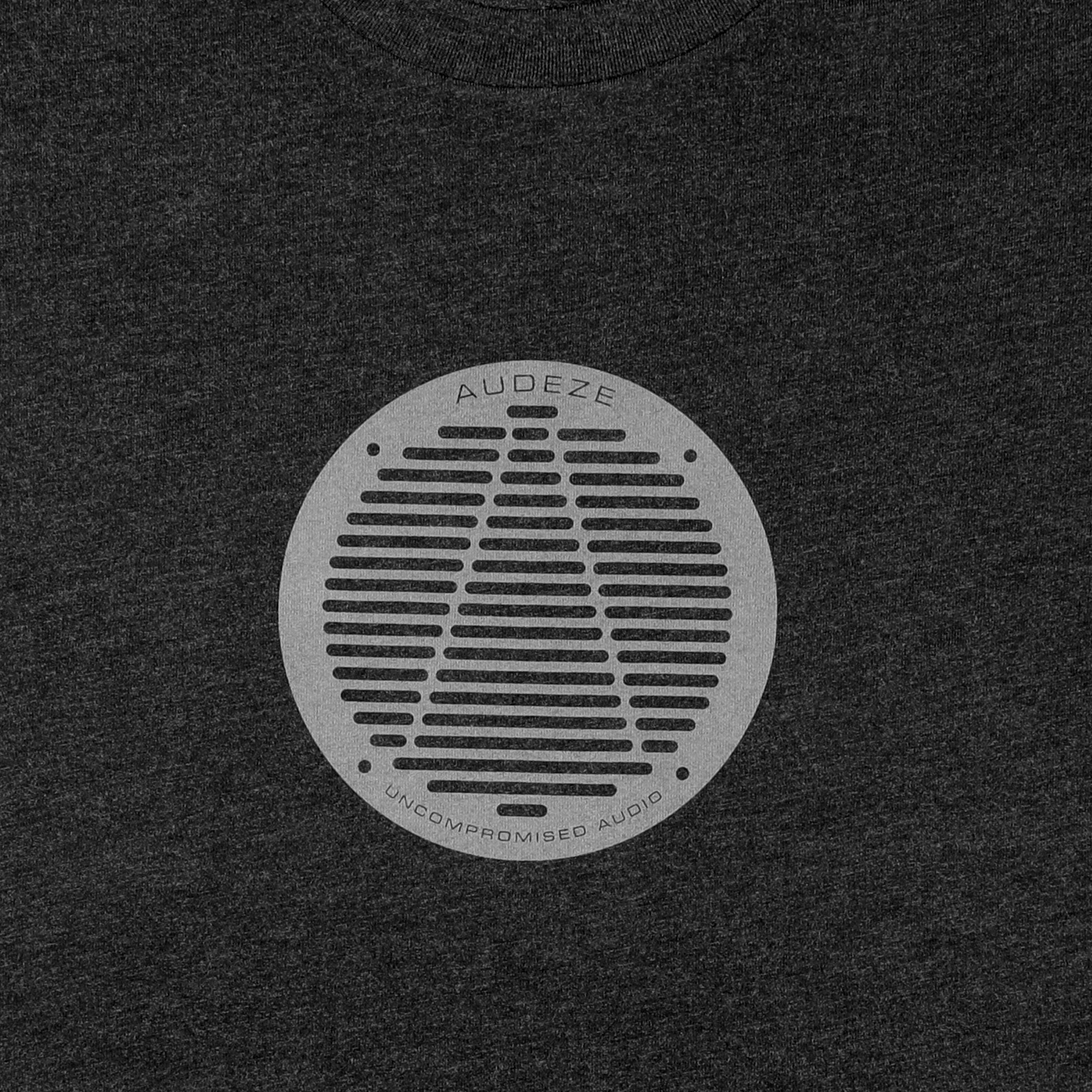 Gray Audeze t-shirt featuring a circular logo print, highlighting "Uncompromised Audio" in a modern design.