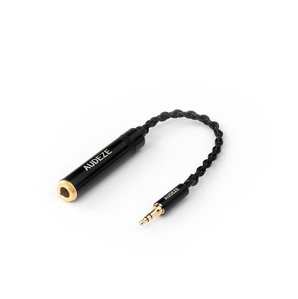 Audeze audio adapter cable, black braided design with gold accents, enhances headphone sound quality.