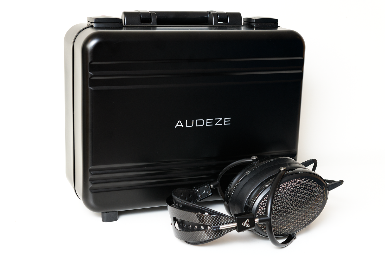 Audeze black headphone case with headphones, featuring metal accents and a sleek design. Perfect for audiophiles.