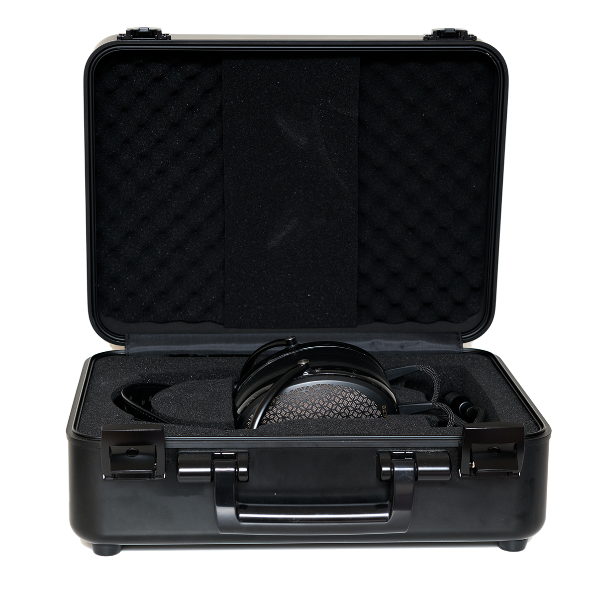 Black hard case with foam interior, housing professional headphones for secure storage and easy transport.