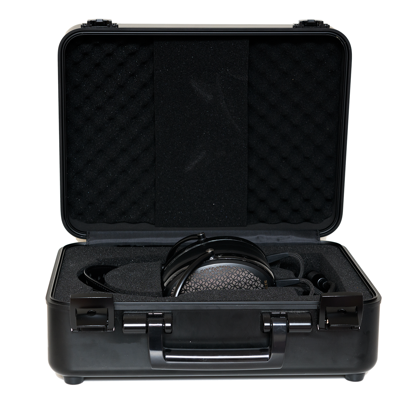 Black hard case with foam interior, housing professional headphones for secure storage and easy transport.