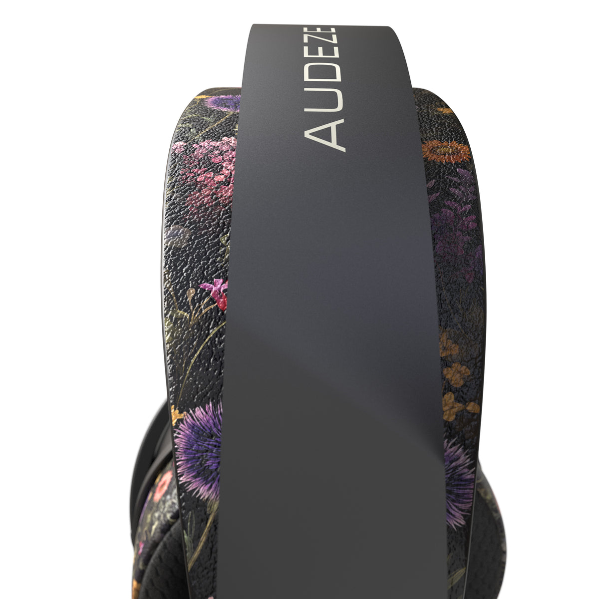 Audeze floral headphones with a black frame and vivid purple and green accents. Stylish and comfortable design.