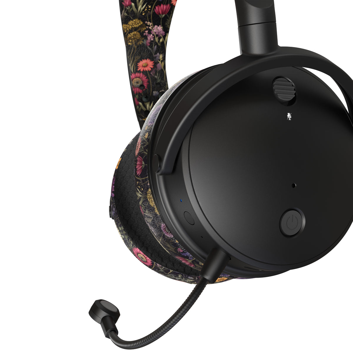 Black wireless headset with floral fabric accents, featuring a cushioned ear cup and a sleek microphone.