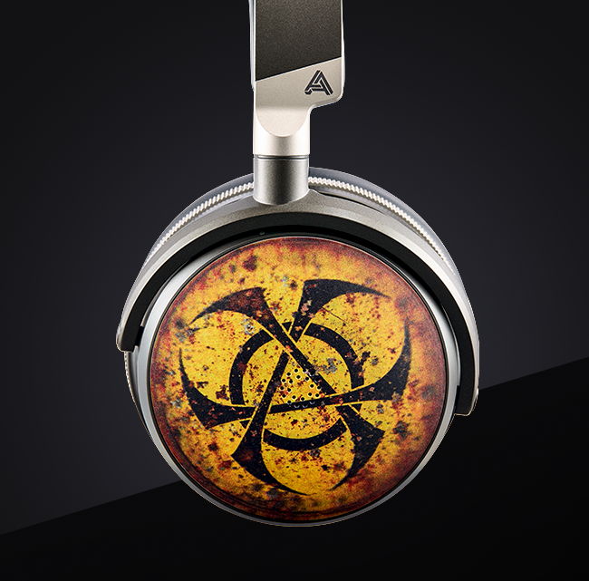 Metallic silver over-ear headphones with a distressed yellow and black biohazard logo. Stylish and bold design.